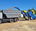Self-propelled grain cleaner OBС-70M4L cleans and loads wheat into a truck Self-propelled grain cleaner OBС-70M4L cleans and loads wheat into a truck, photo